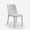 Stel voor buiten in de tuin rotan tafel van 150x90cm met 6 witte stoelen Meloria Light. 
