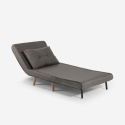 Stoffen klapbed fauteuil met houten pootjes Miriam Korting