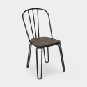 Industrieel set met rechthoekige tafel 120x60 en en 4 design stoelen van staal en hout Otis 